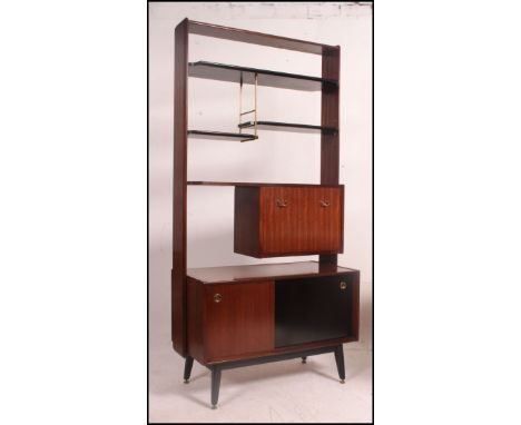 Eric Gomme for G-Plan, a 1950s room divider, with shelf and cupboard arrangement above a cupboard and drawer base in afrormos