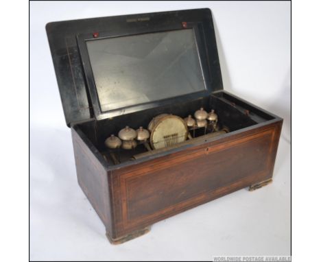 A 19th Century Swiss Cylinder Music Box, with 33cm brass cylinder and triple steel comb movement playing ten airs, six bells 