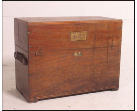 A vintage industrial trunk by Dobbie and M Innes Ltd Glasgow, engineering and nautical instrument maker fitted with hide leat