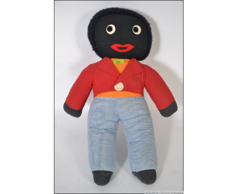 A large Chad Valley Chiltern Golly ? soft toy, circa 1970's, blue and white top, red and pink trousers. Measures: 63cms high.