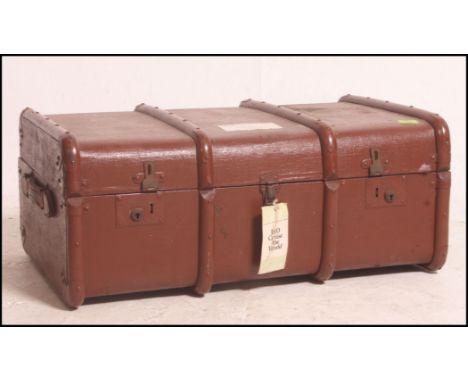A good early 20th century canvas and cane bound steamer trunk having brass latches