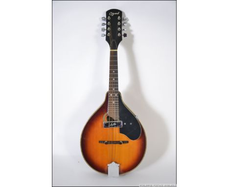 An Ozark Professional solid top Ozark 2254 'A' Model Mandolin - Oval Sound Hole Schaller pick up, rosewood fret board with mo