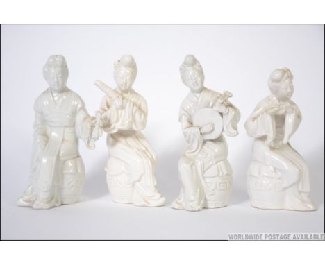 Group of 4 fine Japanese ceramic musicians , marked to base with red ink. Measures: 13cms high.