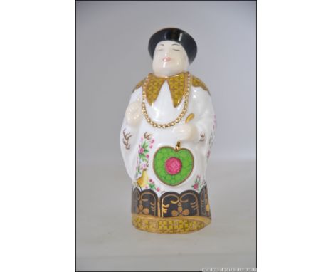 A Royal Worcester Connoisseur Collection candle snuffer in the form a Chinese Man entitled Mandarin. Measures 9cms high