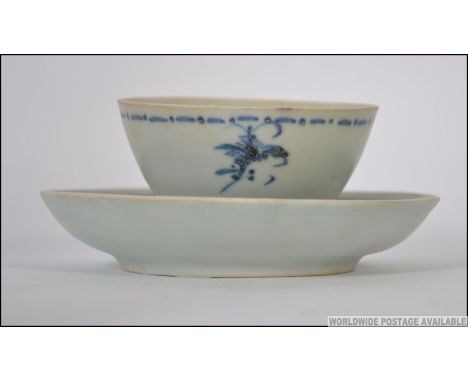 A Tek Sing Treasures Chinese ceramic tea bowl and saucer, each bearing label complete with the certificate. Measures: 8cms hi
