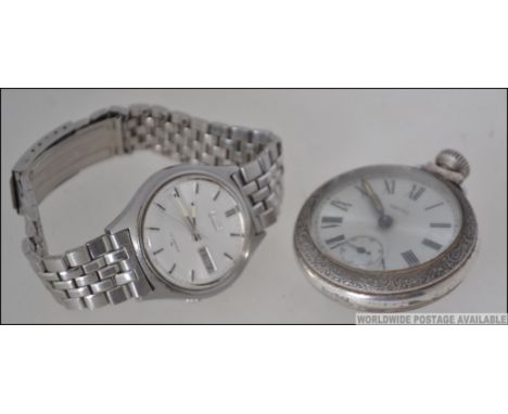 A 1970's vintage gentlemans Seiko wristwatch with baton numerals, date aperture on expanding steel bracelet. Together with a 