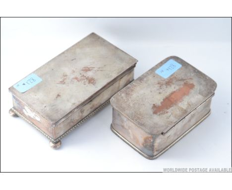 2 19th century silver plated table snuff  boxes / cigarette boxes, one on flat bell feet, both with gadrooned borders. Larges