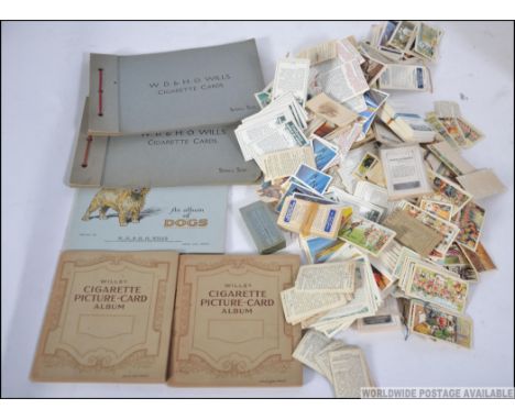 An excellent collection of cigarette cards in albums along with loose and collections banded loose. Albums to include John Pl