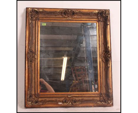 A large Victorian mirror with stunning adams revival gilded frame having mirror to centre with original frame, later but well