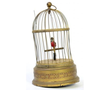 A BRASS AND CLOCKWORK SINGING BIRD IN A CAGE AUTOMATON, 28CM H, EARLY 20TH C 