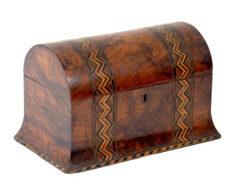 A VICTORIAN WALNUT TEA CADDY ON FLARED BASE DECORATED WITH COLOURED STRAW WORK ZIG ZAG BANDS, THE FITTED INTERIOR RETAINING T