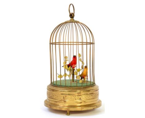 AN EMBOSSED BRASSAND  CLOCKWORK SINGING BIRD IN A CAGE AUTOMATON, 24CM H, 20TH C 