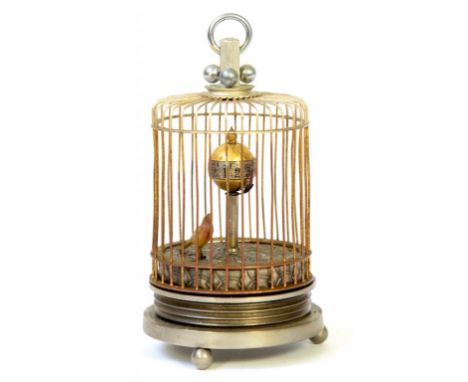 A MINIATURE OXIDISED METAL SINGING BIRD AND GLOBE TIMEPIECE IN A BIRDCAGE AUTOMATON, 13CM H 