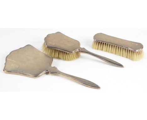 A GEORGE VI SILVER THREE PIECE BRUSH SET ENGINE TURNED BIRMINGHAM 1945  