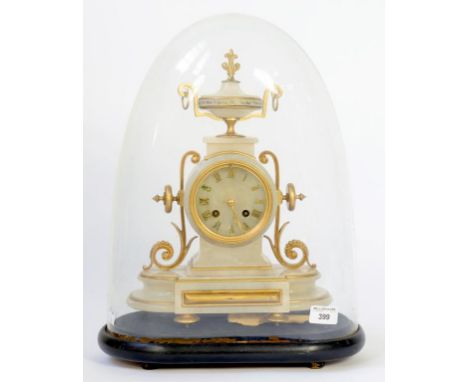 A FRENCH GILTMETAL MOUNTED ONYX MANTEL CLOCK, 37CM H, ON EBONISED WOOD BASE BENEATH GLASS DOME 