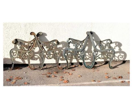 Two pairs of modern cast metal bench ends, 42cm x 73cm high &amp; 46cm x 74cm high 