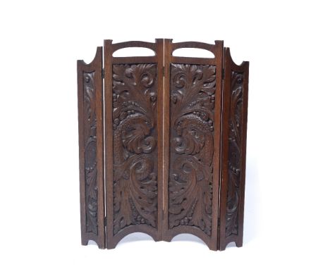 Arts and Crafts  folding firescreen or draught screen with carved decoration, oak  79cm high 