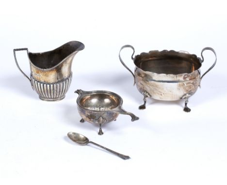 Silver tea strainer and spoon,  silver cream jug and a sucrier (3)