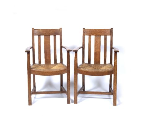 Heals  pair of armchairs, light oak with rush seats  one with label to underside  94cm high (2)