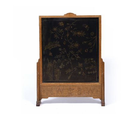 Cotswold School oak firescreen  with embroidered central panel, the frieze with carved initials 'HW' and 'EW' plus oak leaf m