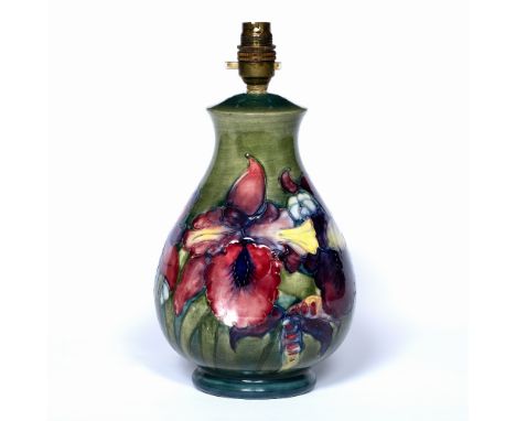 Moorcroft pottery table lamp Orchid pattern on green ground impressed marks to the base  30cm high including the fitting 