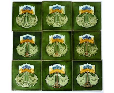 Nine Craven Dunhill tiles  with Art Nouveau stylised tubeline decoration  15cm (9)