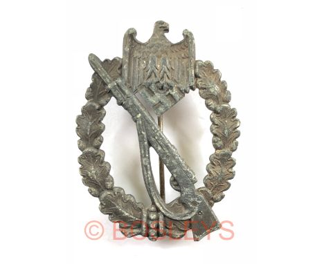 German Third Reich WW2 Army / Waffen SS Infantry Assault Badge by Carl Wilde, HamburgA good late war silvered die-cast exampl