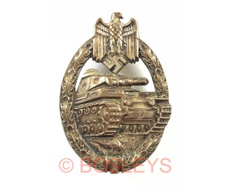 German Third Reich WW2 Army / Waffen SS Tank Assault Badge.A good die-cast silvered example. Approaching panzer within an ova