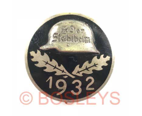 German Weimar. Der Stahlhelm membership badge.A good silvered 30 mm example. Circular black enamel badge with steel helmet in