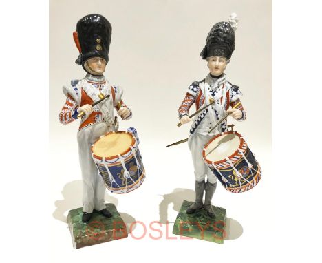 Foot Guards Drummers Continental Porcelain Figures.Two fine quality figures, the first depicts a Guards drummer circa 1792. H