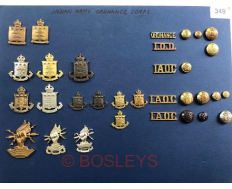 Indian Army Ordnance Corps Insignia.A good carded selection of cap badges, pagri badges, collar badges, shoulder titles and b