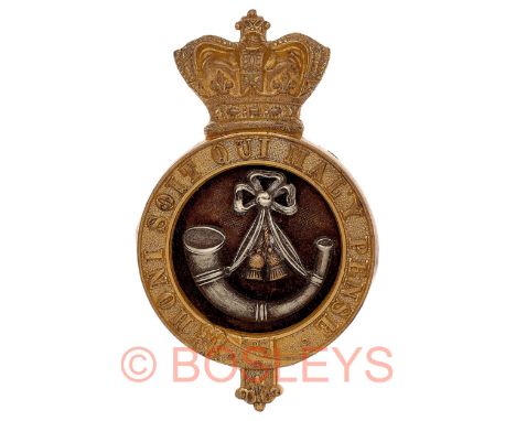 Durham Light Infantry Victorian Officer’s glengarry badge circa 1881-96.A good die-stamped gilt example. Crowned Garter with 