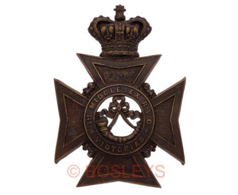 1st Middlesex Rifle Volunteer Corps Victorian OR’s helmet plate circa 1880-92.A good scarce die-stamped blackened brass examp