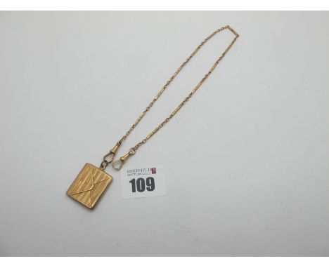A Chester Hallmarked 9ct Gold Hinged Envelope Pendant, engine turned with heart shape vacant cartouche, on a alternate elonga
