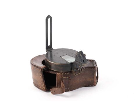 A Victorian lacquered brass pocket prismatic compass, probably by J. Hicks, London, 7cms diameter, in leather case.