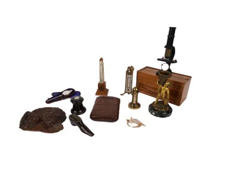 A match striker in the form of a fisher boy, on marble base together with a cigar case; a cased field microscope; pair of gol