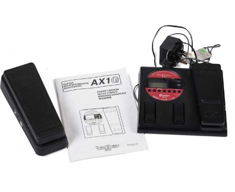 A Toneworks AX1G guitar effects processor with instructions; and a Dunlop Crybaby model GCB-95. (2)