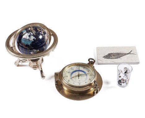 A specimen stone globe, on gilt metal stand, with three cabriole legs joined by a compass set undertier, approximately 31cms 
