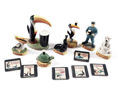 A selection of Guinness collectibles, including: a set of six ‘My Goodness My Guinness’ coasters; a ‘Have a Guinness When you