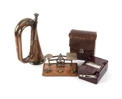 An Evershed and Vignoles ‘Megger’ electrical tester; a pair of brass and oak postal scales and weights; and a brass and coppe