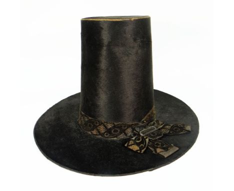 TRADITIONAL VICTORIAN MOLESKIN LADIES WELSH HAT of typical tapered chimney form with wide brim, woven ribbon with arranged bo