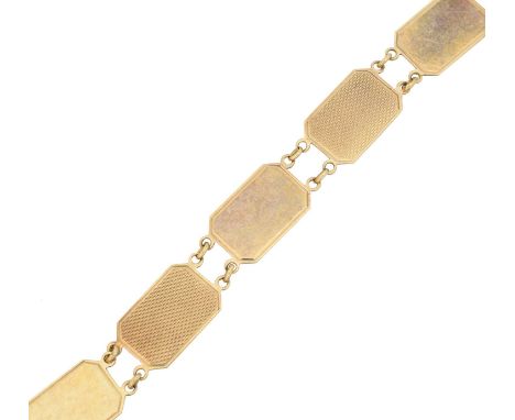 A 9ct gold bracelet, designed as a series of polished and engine turned octagonal links, hallmarks for Birmingham, length 18.