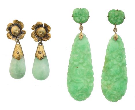 Two pairs of jade earrings, the first pair with carved floral jade drop suspended from a carved butterfly surmount, the secon
