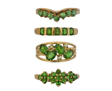 Four 9ct gold gem-set dress rings, to include a tsavorite garnet band ring, together with three diopside dress rings, ring si