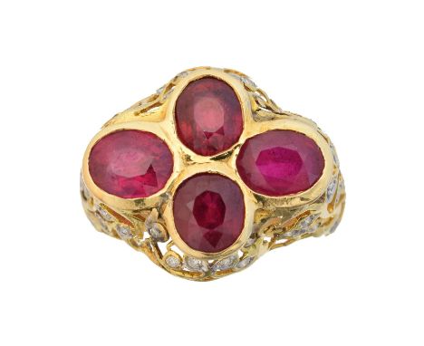 A ruby and diamond dress ring, the oval shape ruby quatrefoil cluster within a brilliant cut diamond openwork surround, estim
