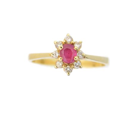 A ruby and diamond cluster ring, the oval shape ruby within a brilliant cut diamond surround, estimated total diamond weight 