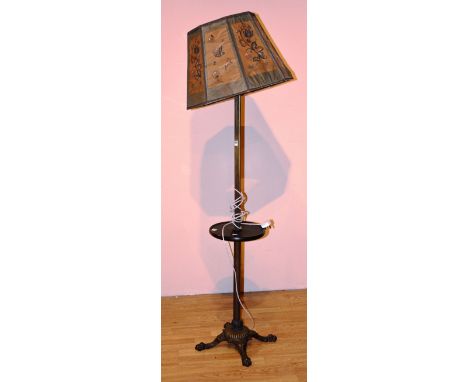 A gilded cast floor lamp, with shade, ending in animal paw feet, 168cm high