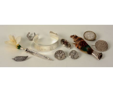 A chunky Tiffany & Co silver bangle, marked '925 T & Co 1837 to front', together with a collection of silver and white metal 