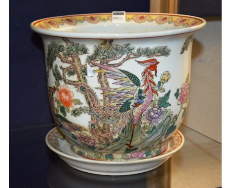 A Chinese famille verte planter on stand, decorated with birds of paradise in foliage, orange character marks to base, 21cm h