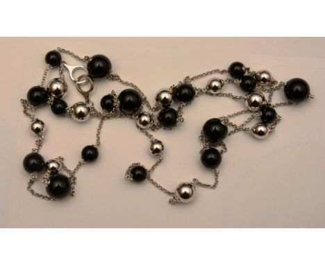 A Georg Jensen silver and black enamel necklace, with interspersed silver and black enamel beads of varying sizes, stamped 'G